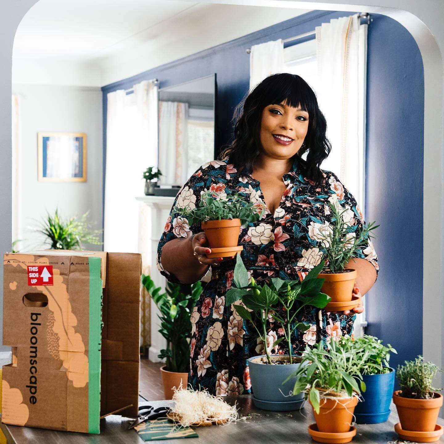 Food blogger Angela Davis unboxes a Bloomscape Aromatic Herb collection in her home kitchen
