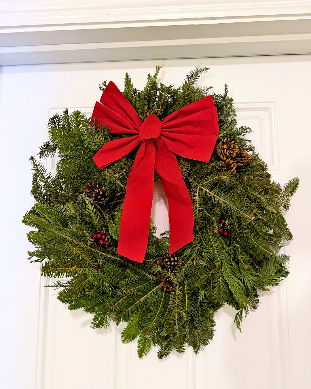 NORDIC MIX ON DOOR festive nordic mix wreath hanging on door
