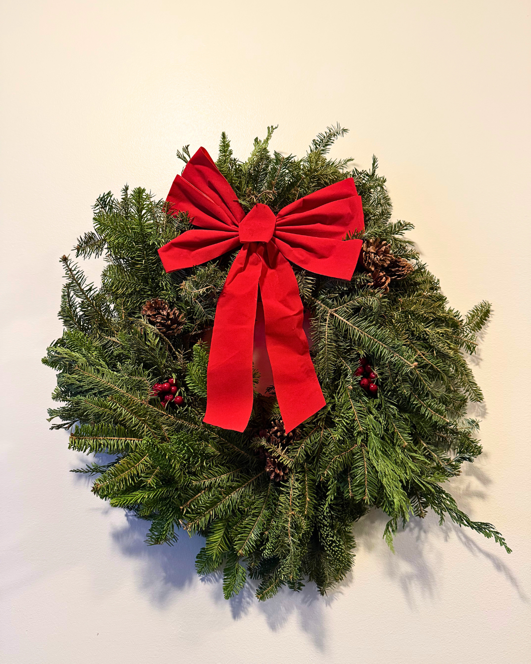 NORDIC MIX ON WALL festive nordic mix wreath hanging on wall